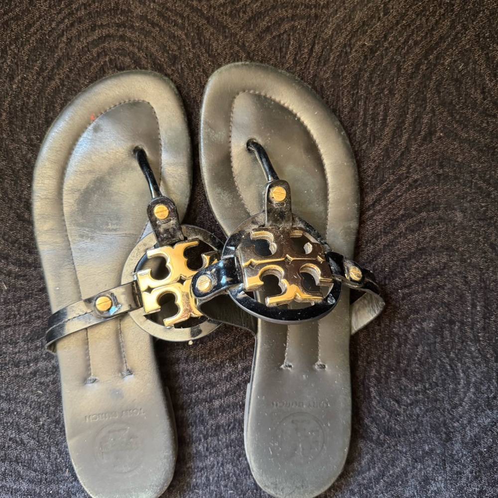 Tory Burch black flip flops with gold monogram